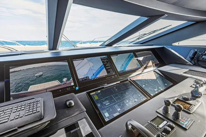 Slide: The Image of Control panel of 2018 Custom Line 120 yacht with advanced navigation screens. - 52