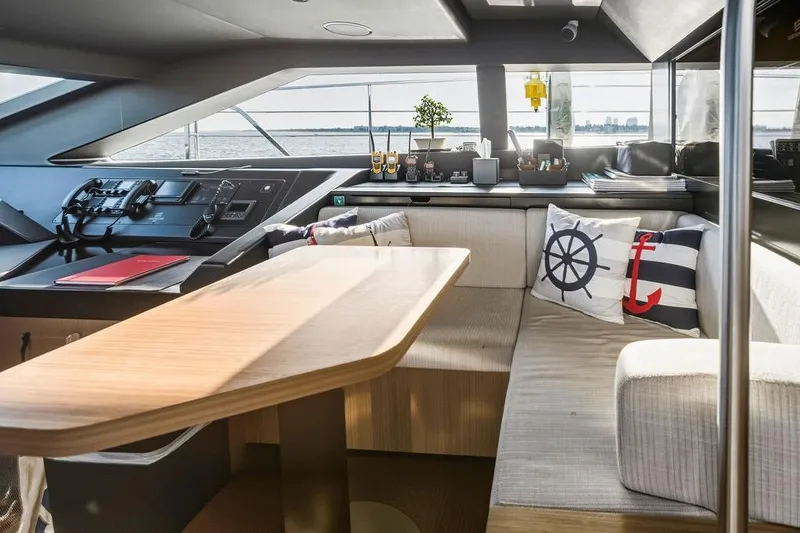 Slide: The Image of Luxurious 2018 Custom Line 120 yacht interior with modern helm and cozy seating area. - 53