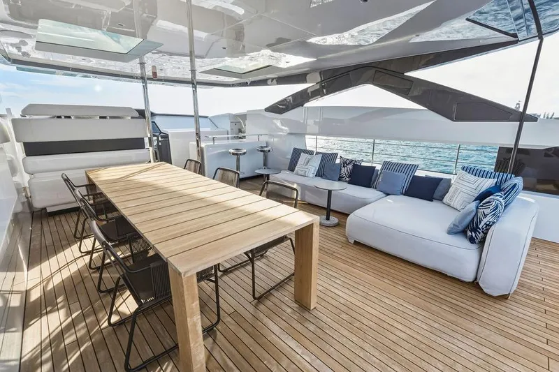 Slide: The Image of Luxurious 2018 Custom Line 120 yacht deck with elegant seating and dining area. - 54