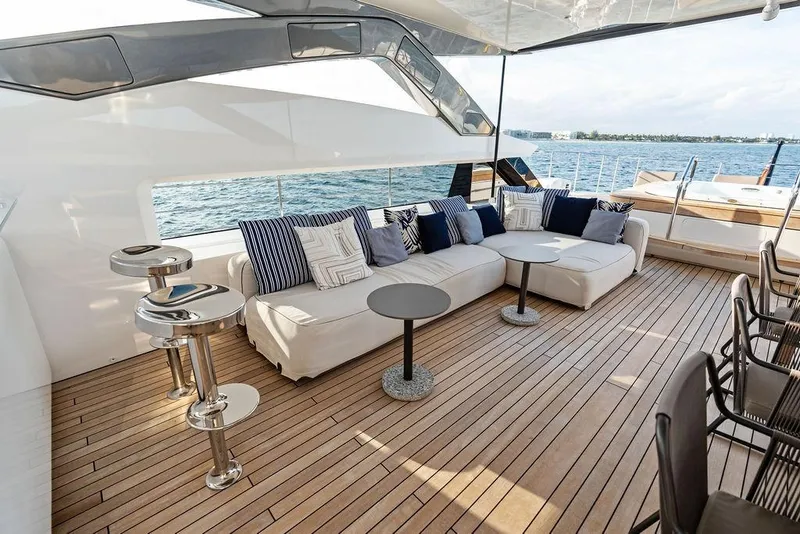 Slide: The Image of Luxurious 2018 Custom Line 120 yacht deck with elegant seating and ocean view. - 56