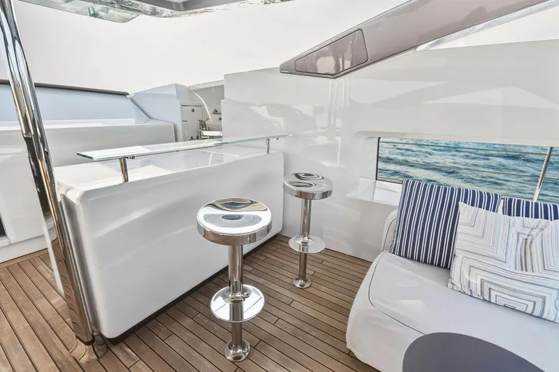 Slide: The Image of Luxurious 2018 Custom Line 120 yacht interior with modern bar and seating area. - 57