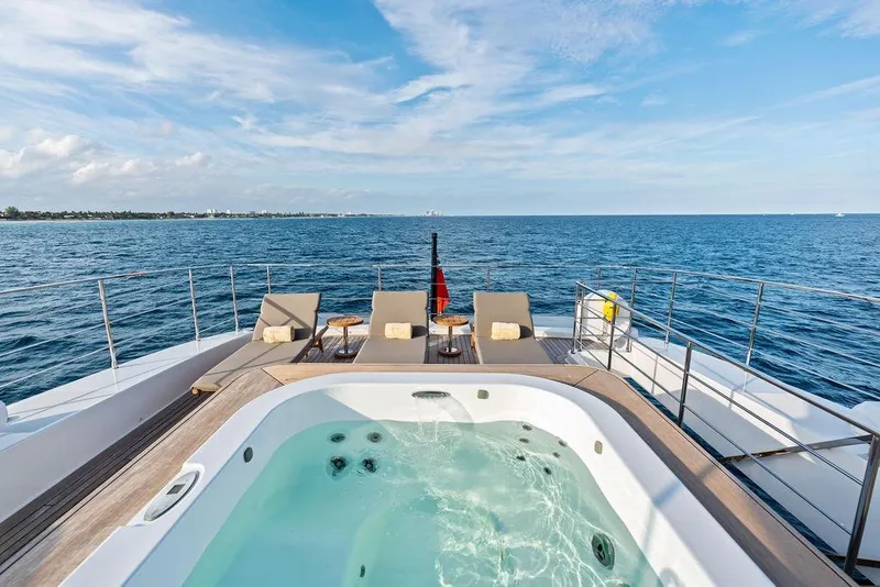 Slide: The Image of Luxurious 2018 Custom Line 120 yacht deck with jacuzzi and ocean view. - 62