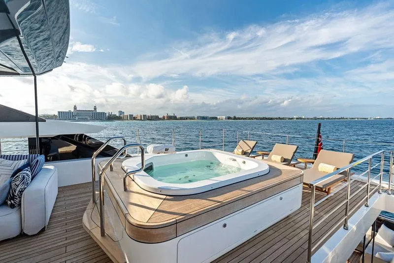 Slide: The Image of Luxurious 2018 Custom Line 120 yacht deck with jacuzzi and ocean view. - 63