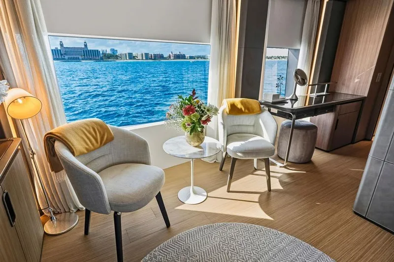 Slide: The Image of Luxurious yacht interior with ocean view, featuring elegant seating and decor, Custom Line 120, 2018. - 75