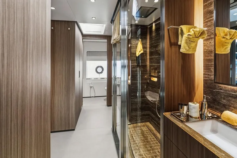 Slide: The Image of Luxurious yacht bathroom with wood paneling, modern fixtures, and elegant design, Custom Line 120, 2018. - 82