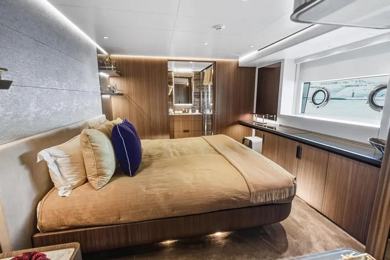 Slide: The Image of Luxurious yacht bedroom interior, Custom Line 120, 2018 model, featuring elegant wood paneling. - 88