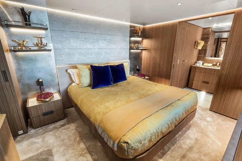 Slide: The Image of Luxurious bedroom interior on a 2018 Custom Line 120 yacht, featuring elegant decor and modern amenities. - 89