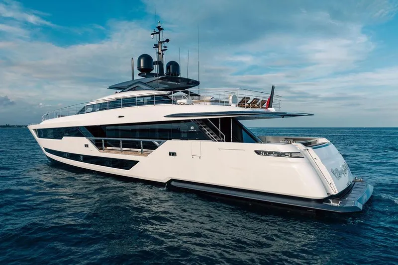 Slide: The Image of Luxurious 2018 Custom Line 120 yacht cruising on open sea under clear skies. - 9