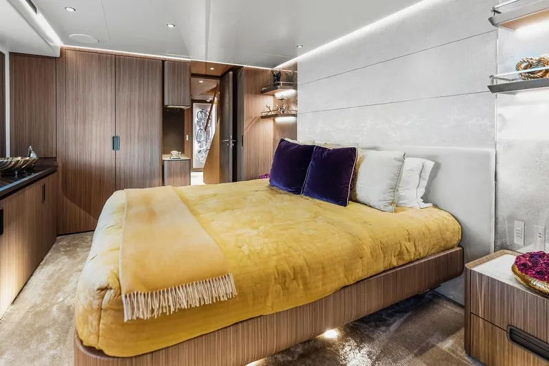 Slide: The Image of Luxurious bedroom interior on a 2018 Custom Line 120 yacht, featuring modern design and plush bedding. - 94