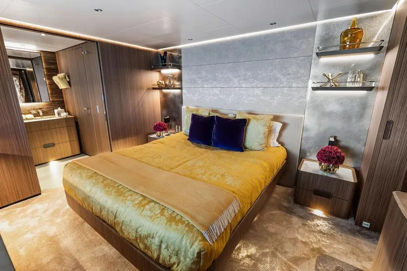 Slide: The Image of Luxurious yacht bedroom with elegant decor, featuring a plush bed and modern furnishings, Custom Line 120, 2018. - 96
