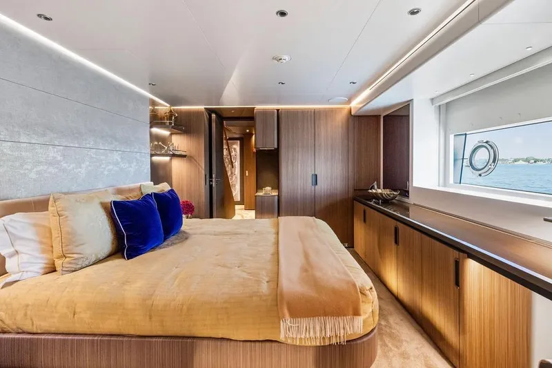 Slide: The Image of Luxurious yacht bedroom with elegant decor, featuring a large bed and scenic ocean view. Custom Line 120, 2018. - 97