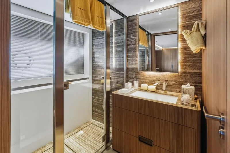 Slide: The Image of Luxurious yacht bathroom with modern wood finishes, glass shower, and elegant lighting, Custom Line 120, 2018. - 99