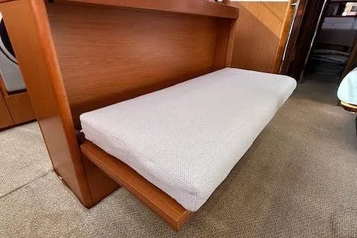 Slide: The Image of 2013 Beneteau Sense 46 yacht cockpit with teak flooring and seating area. - 13