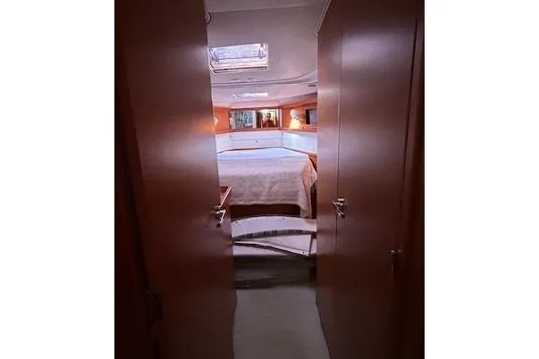 Slide: The Image of Interior of 2013 Beneteau Sense 46 yacht kitchen with modern appliances and wood cabinetry. - 17