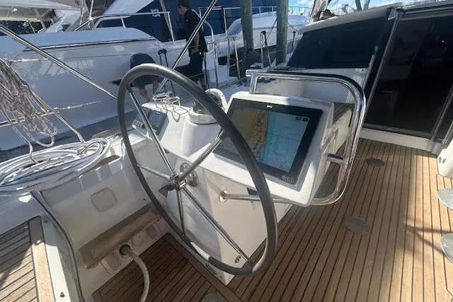 Slide: The Image of Teak deck and hose on 2013 Beneteau Sense 46 sailboat. - 29