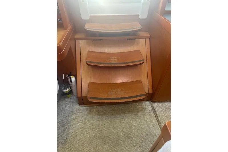 Slide: The Image of Cockpit of 2013 Beneteau Sense 46 yacht with navigation display and wooden deck. - 31