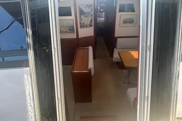 Slide: The Image of 2013 Beneteau Sense 46 yacht bathroom with modern sink and wooden cabinetry. - 36