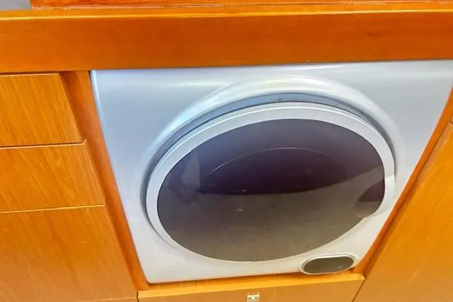 Slide: The Image of Control panel of a 2013 Beneteau Sense 46 yacht with wooden cabinetry. - 40