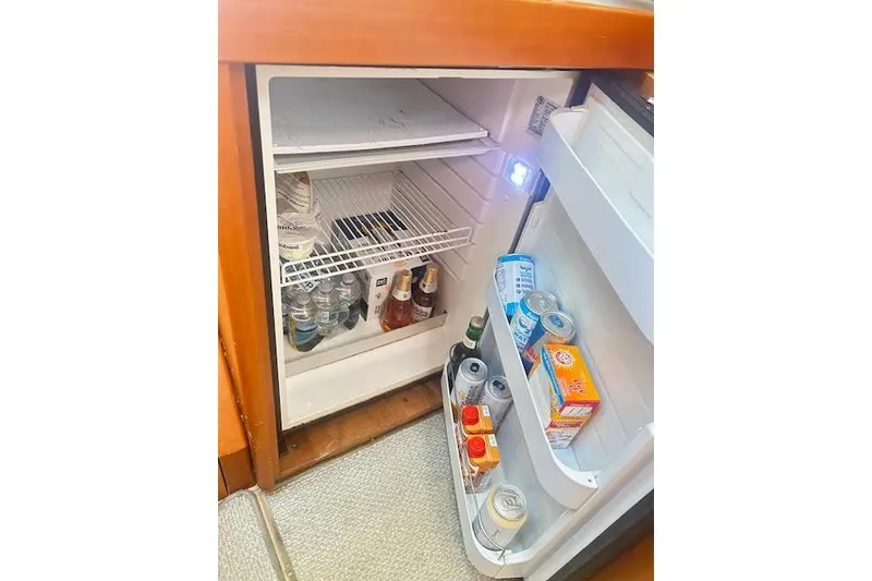 Slide: The Image of 2013 Beneteau Sense 46 yacht cockpit with wooden table and seating. - 43