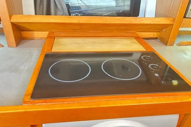 Slide: The Image of Luxurious cabin interior of 2013 Beneteau Sense 46 yacht with wooden finishes. - 49