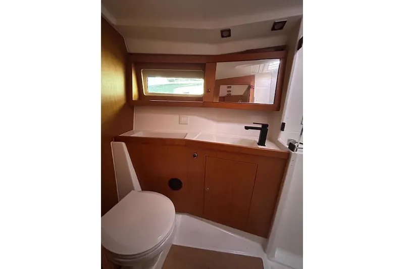 Slide: The Image of Interior of 2013 Beneteau Sense 46 yacht with nautical artwork and sculpture. - 52