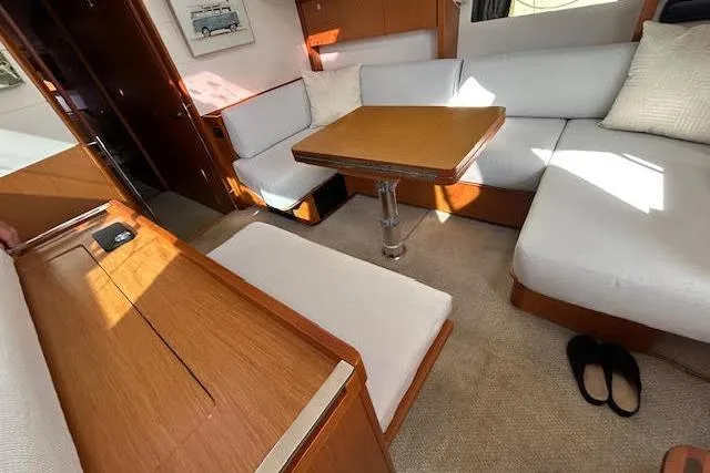 Slide: The Image of Interior of 2013 Beneteau Sense 46 yacht with cozy seating and stylish decor. - 54