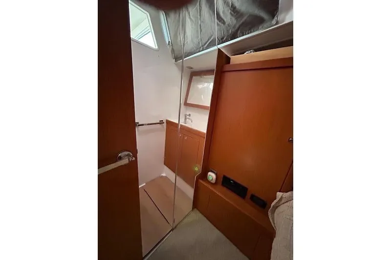 Slide: The Image of Interior of 2013 Beneteau Sense 46 yacht with modern seating and decor. - 57