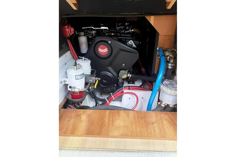 Slide: The Image of Engine compartment of a 2013 Beneteau Sense 46 sailboat, showcasing mechanical components. - 72