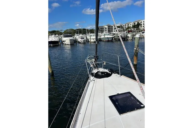 Slide: The Image of 2013 Beneteau Sense 46 yacht with sleek design and solar panels on deck. - 9