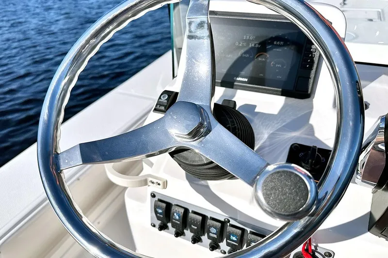 Slide: The Image of Manufacturer Provided Image: Two people fishing on a 2025 Spyder FX17 Flicker boat in calm waters. - 4