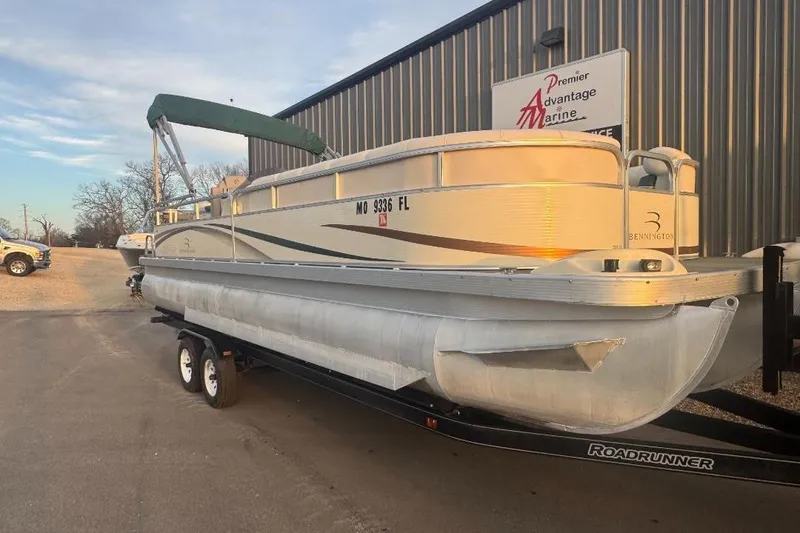 Slide: The Image of 2002 Bennington 2550RL pontoon boat on trailer at Premier Advantage Marine. - 1