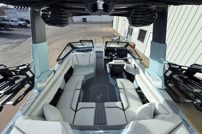 Slide: The Image of 2026 Nautique Super Air Nautique G21 boat interior with sleek seating and advanced controls. - 13