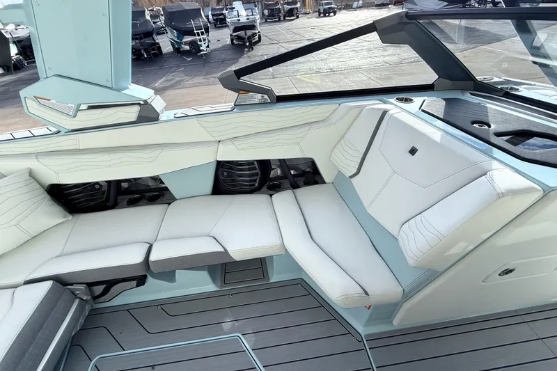 Slide: The Image of 2026 Nautique Super Air Nautique G21 interior with sleek white seating and modern design. - 15