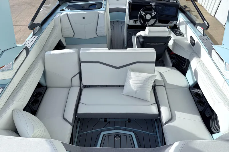 Slide: The Image of Luxurious interior of 2026 Nautique Super Air Nautique G21 boat with plush seating. - 17