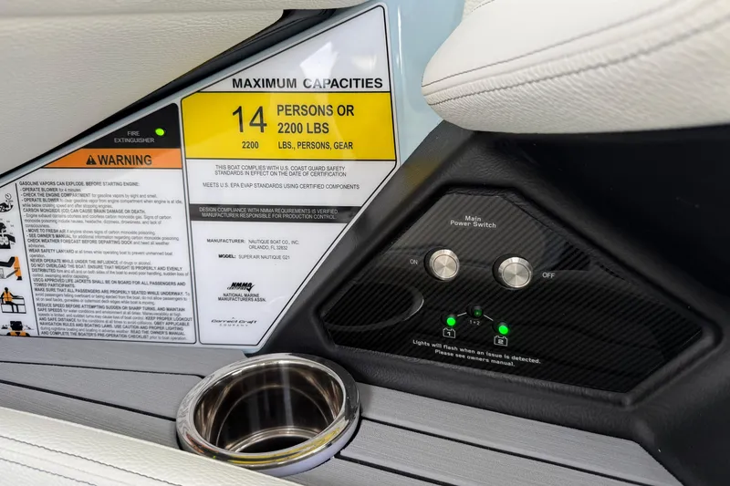 Slide: The Image of Interior of 2026 Nautique Super Air Nautique G21 showing capacity and control panel. - 20