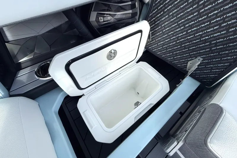 Slide: The Image of 2026 Nautique Super Air Nautique G21 interior storage compartment with open lid. - 28