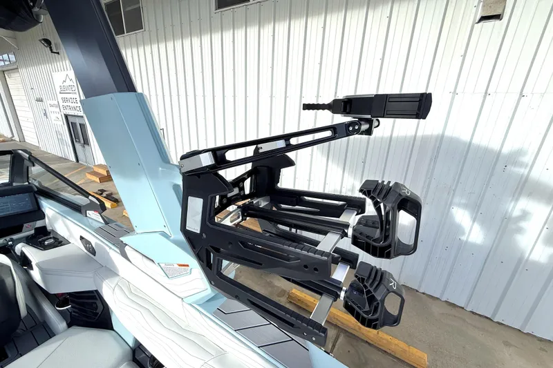 Slide: The Image of 2026 Nautique Super Air Nautique G21 boat with advanced wakeboard rack system. - 33