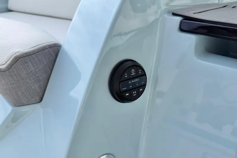 Slide: The Image of 2026 Nautique Super Air Nautique G21 audio control panel detail. - 34