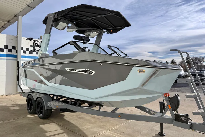 Slide: The Image of 2026 Nautique Super Air Nautique G21 boat on trailer, parked outdoors. - 8