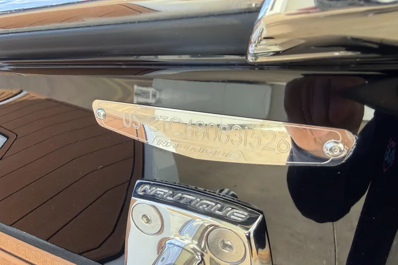 Slide: The Image of 2026 Nautique Super Air Nautique GS22 hull identification plate and logo detail. - 10
