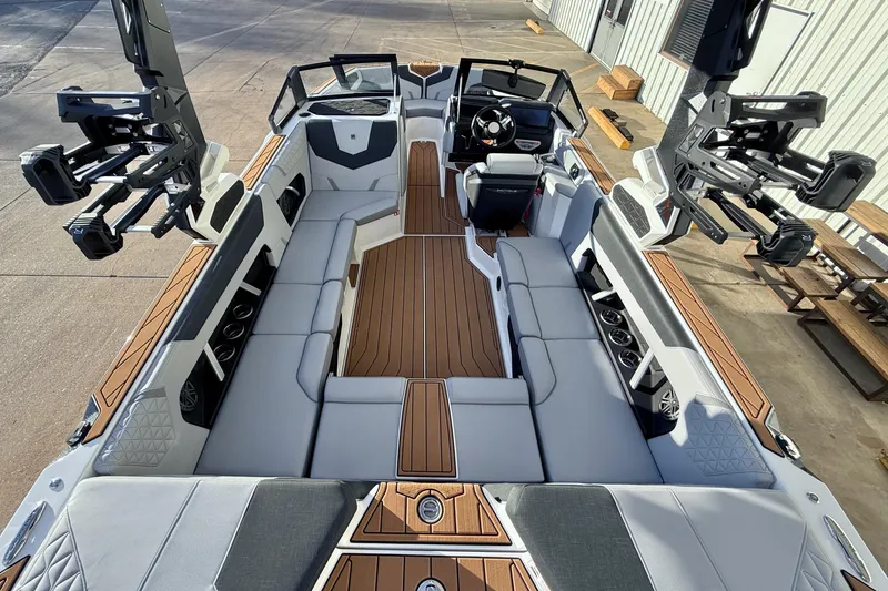 Slide: The Image of 2026 Nautique Super Air Nautique GS22 boat interior with sleek seating and modern design. - 13