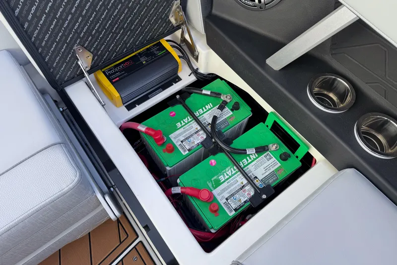 Slide: The Image of 2026 Nautique Super Air Nautique GS22 battery compartment with ProSport HD12 charger. - 20