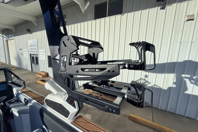 Slide: The Image of 2026 Nautique Super Air Nautique GS22 boat with advanced wakeboard rack. - 21