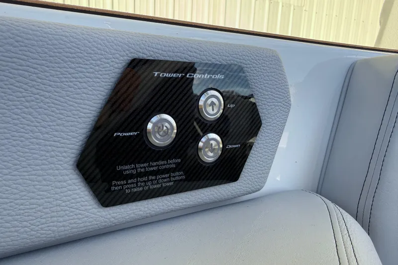 Slide: The Image of 2026 Nautique Super Air Nautique GS22 tower controls with power, up, and down buttons. - 23