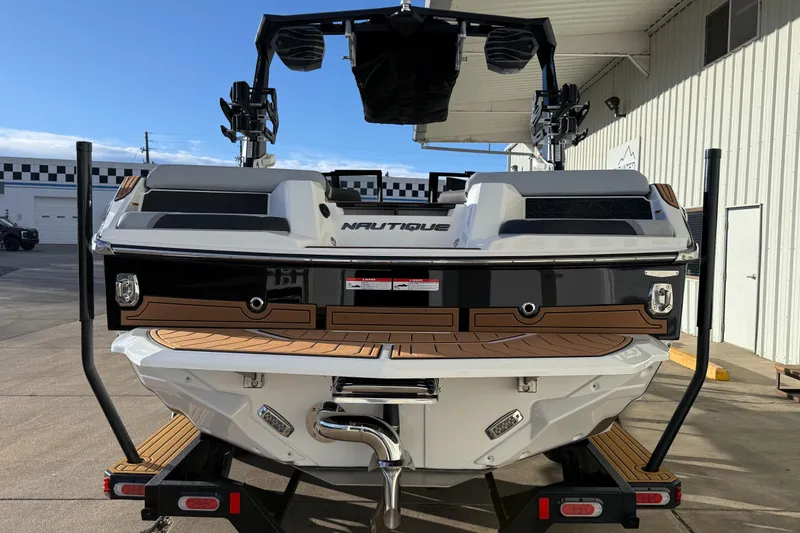 Slide: The Image of 2026 Nautique Super Air Nautique GS22 boat rear view, showcasing sleek design and modern features. - 5