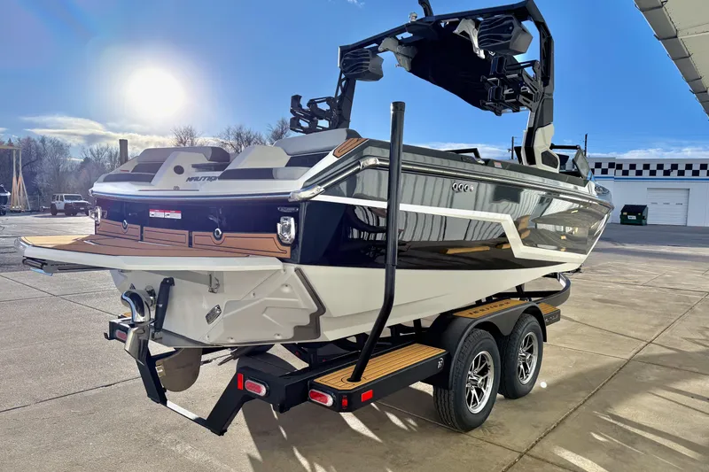 Slide: The Image of 2026 Nautique Super Air Nautique GS22 boat on trailer, sunny day, outdoor setting. - 7