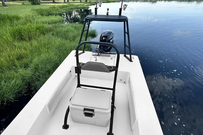 Slide: The Image of Manufacturer Provided Image: 2025 Spyder FX16 Wisp boat on calm water at sunrise. - 4