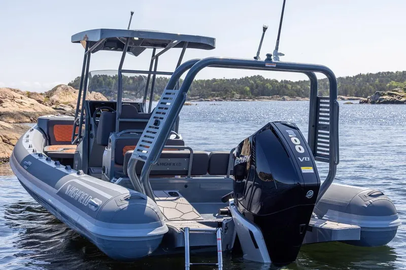 Slide: The Image of Manufacturer Provided Image: 2025 Highfield Sport 760 boat with powerful V8 engine on scenic water. - 2