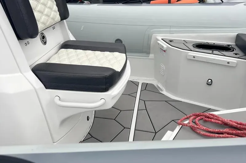 Slide: The Image of Interior of 2025 Highfield Sport 760 boat with cushioned seating and modern design. - 6