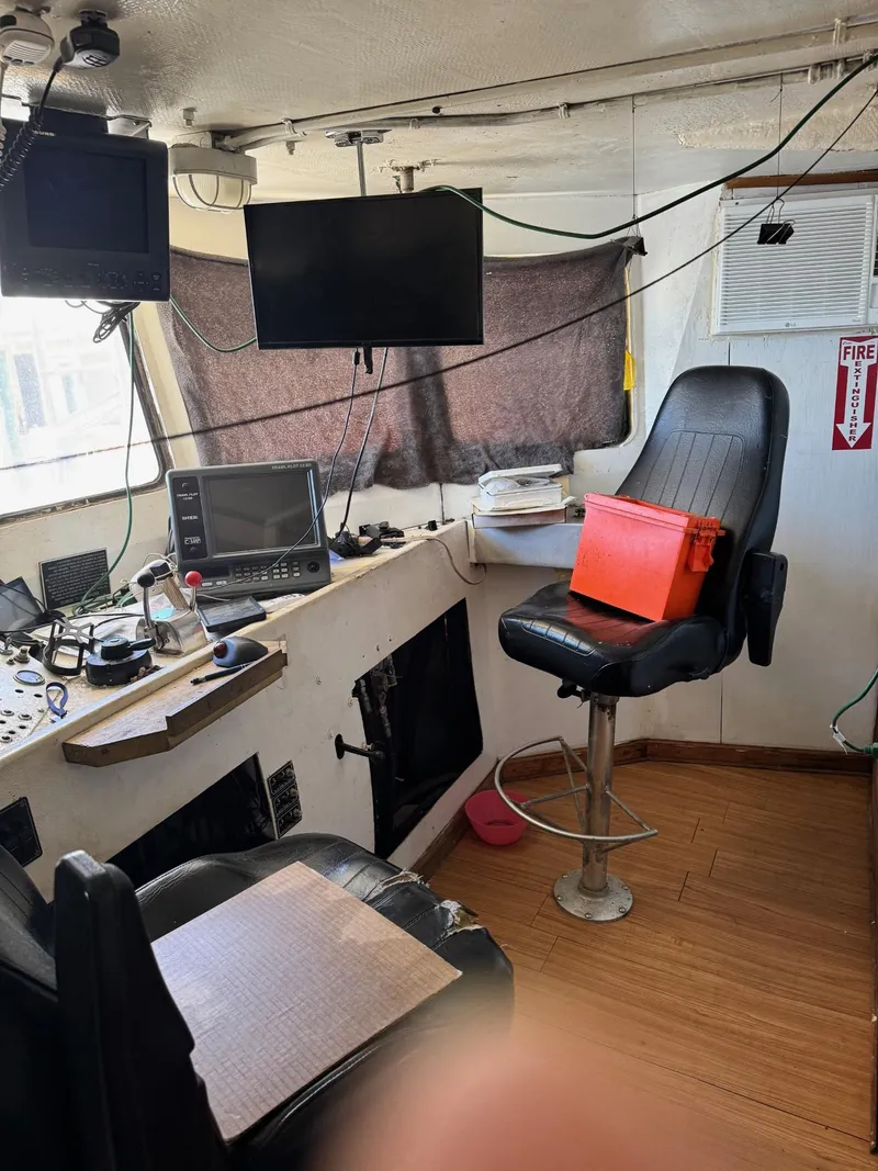 Slide: The Image of Interior of 1971 Butterfish Fishing Trawler with navigation equipment and captain's chair. - 10